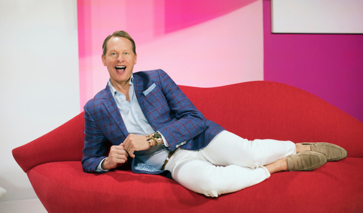 Carson Kressley poses on Red Lips sofa